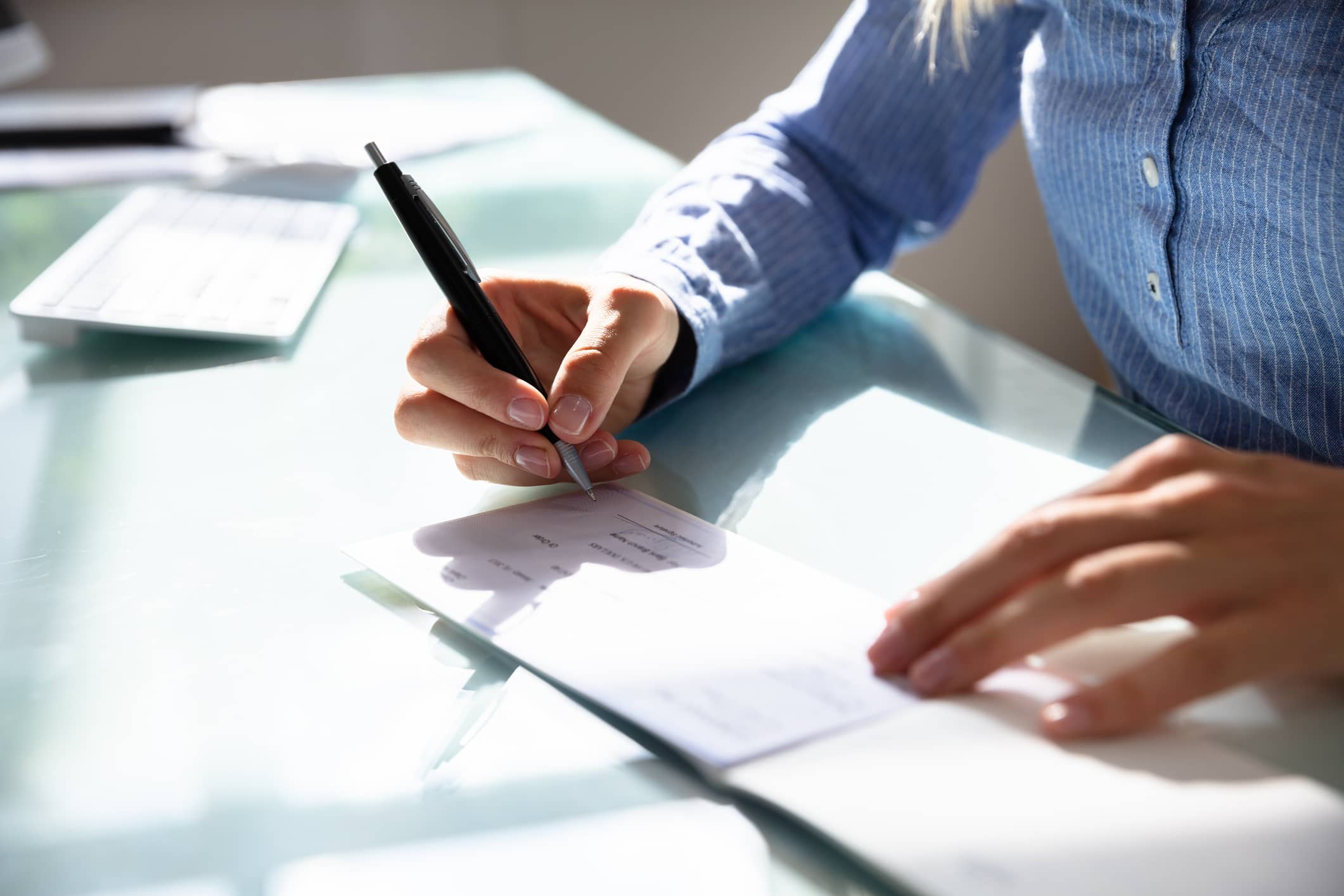 person writing a check