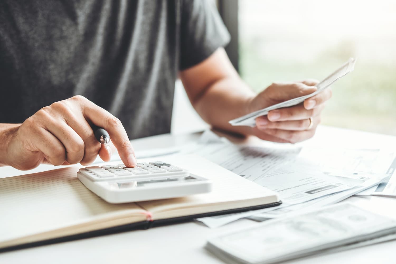 Man using calculator for business accounting