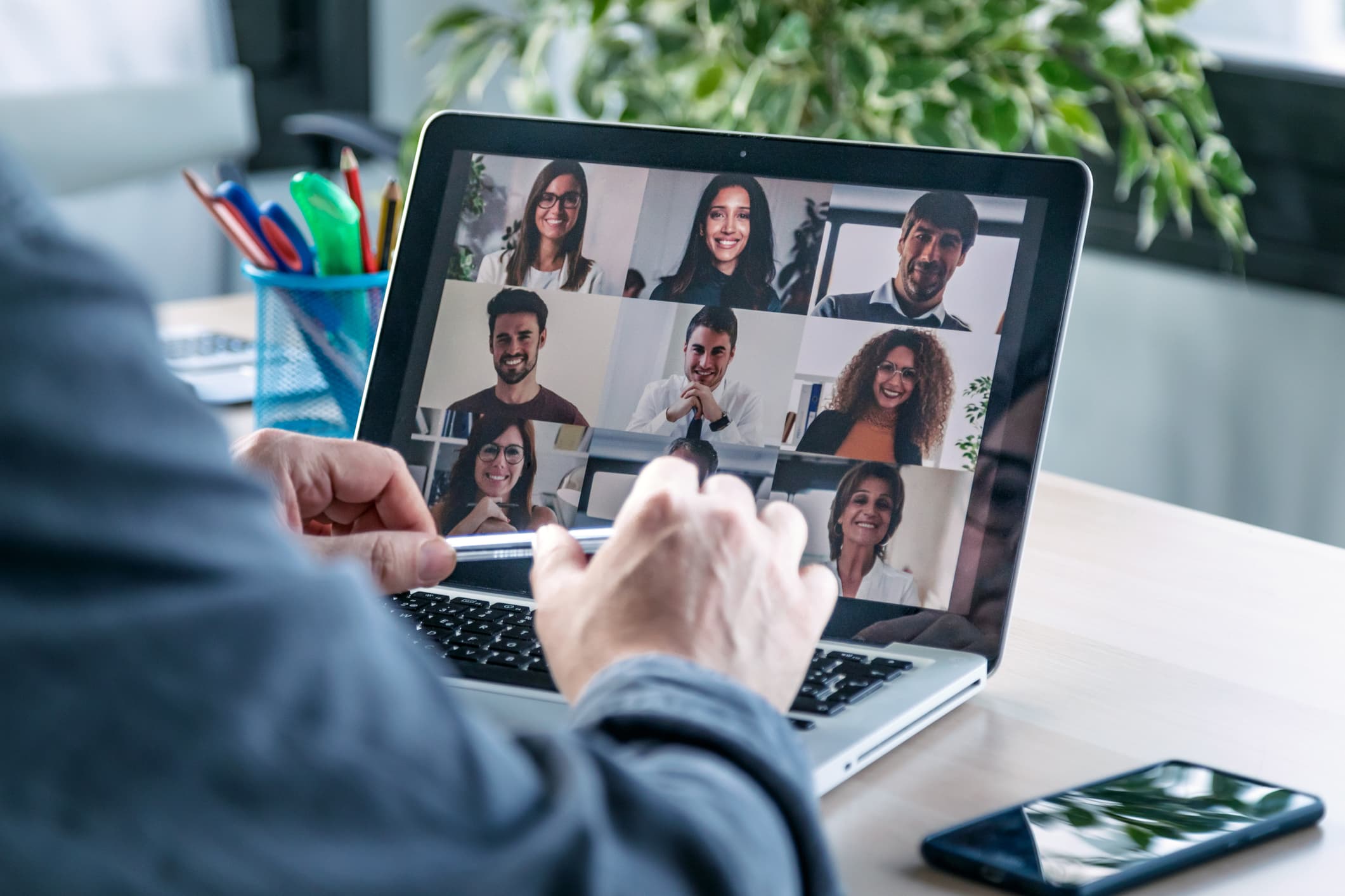 person having a video conference on a laptop