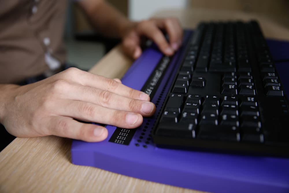 fingers typing on a keyboard