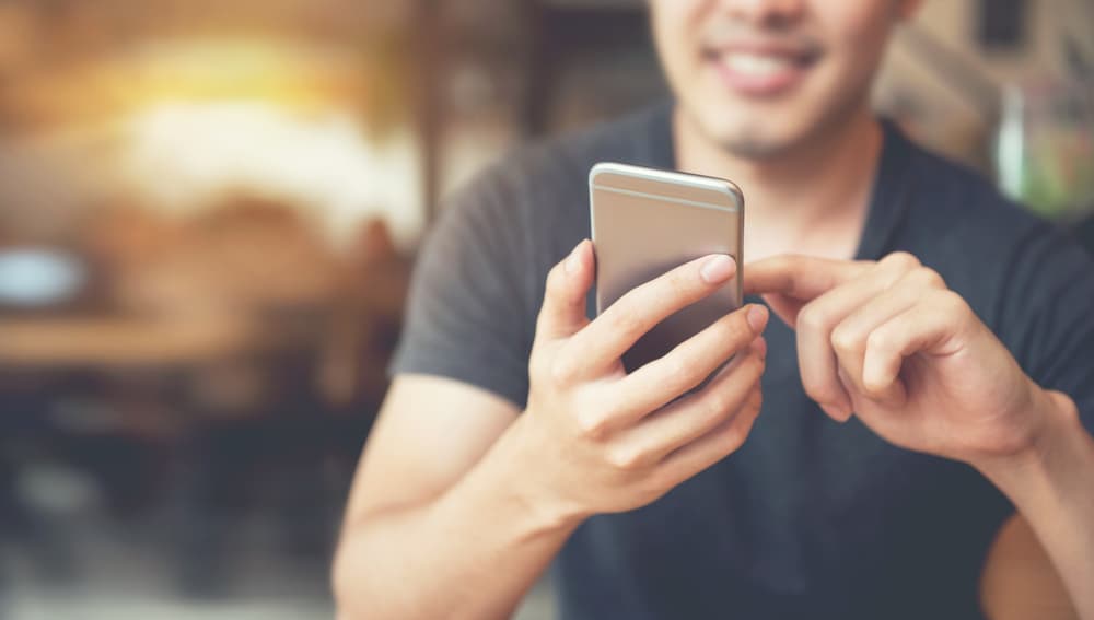 man using a mobile device