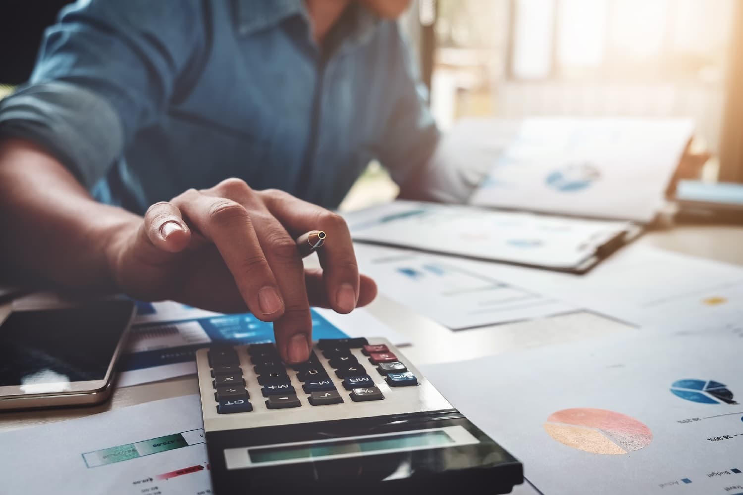 Accountant using a calculator