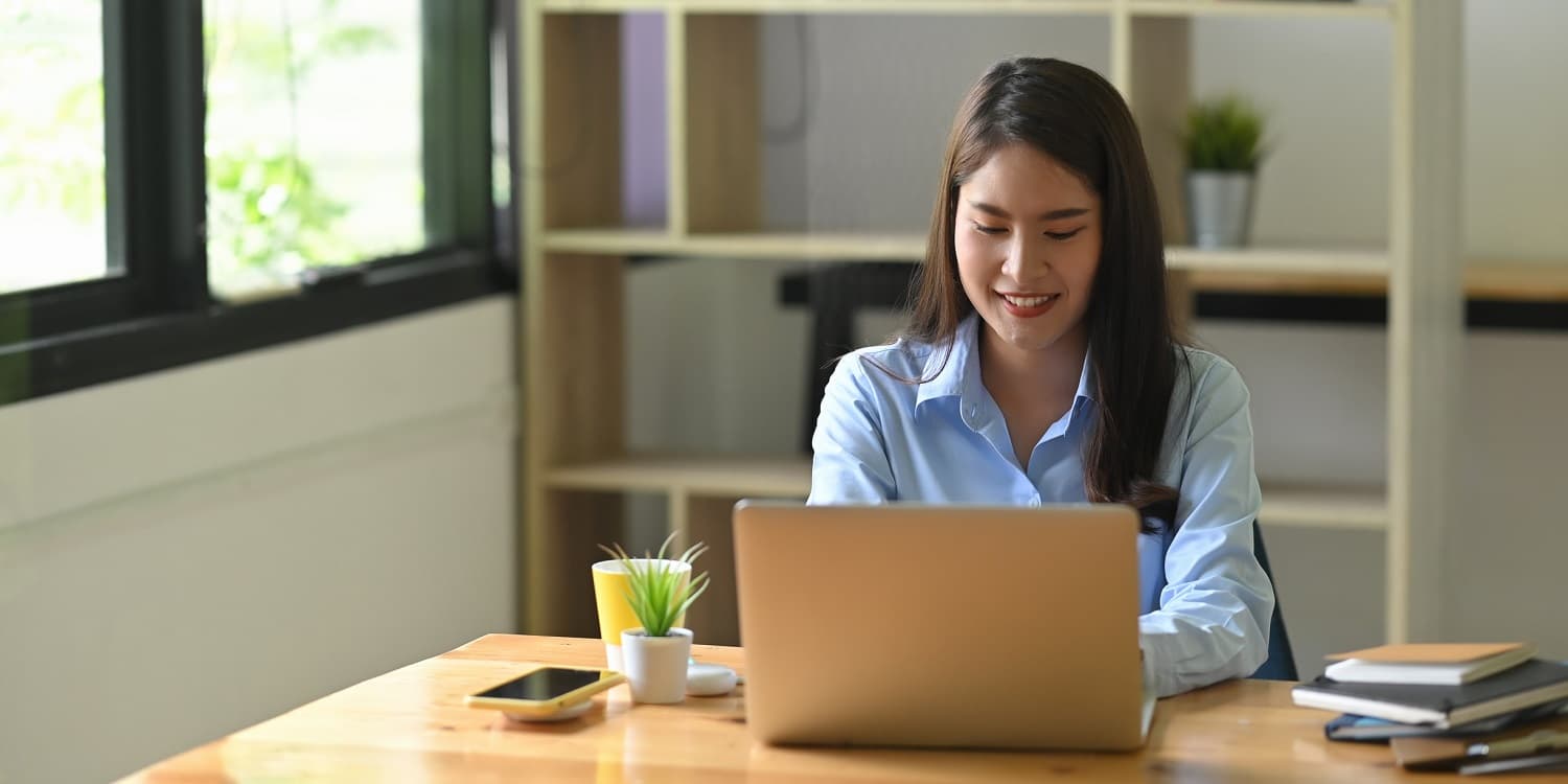 woman using a computer in a home office