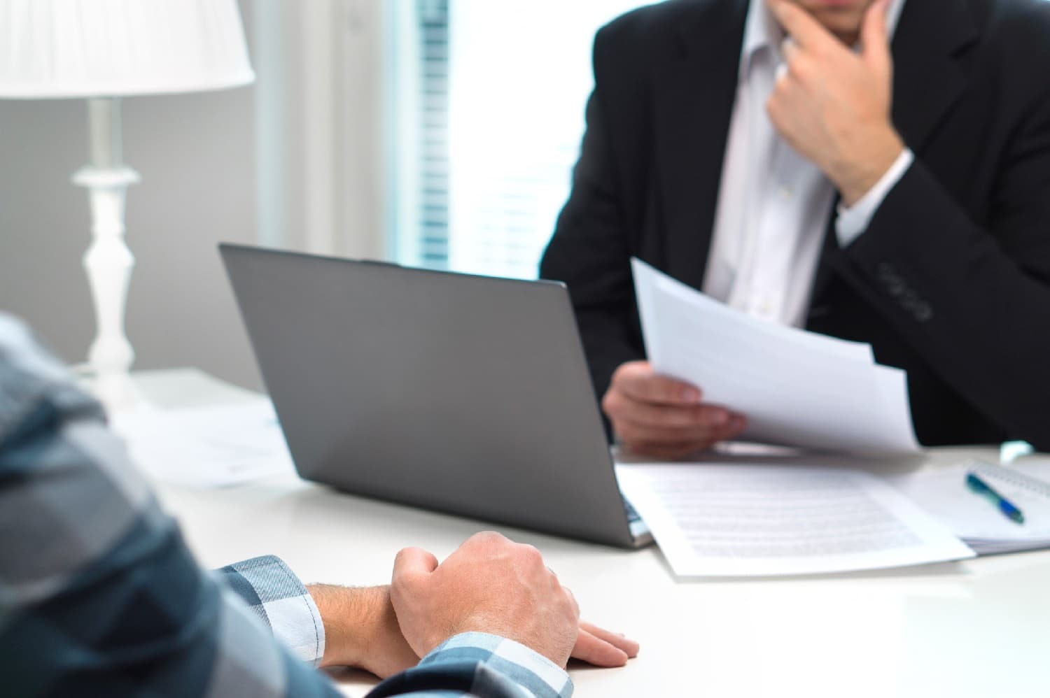 job interviewer holding a candidate's resume