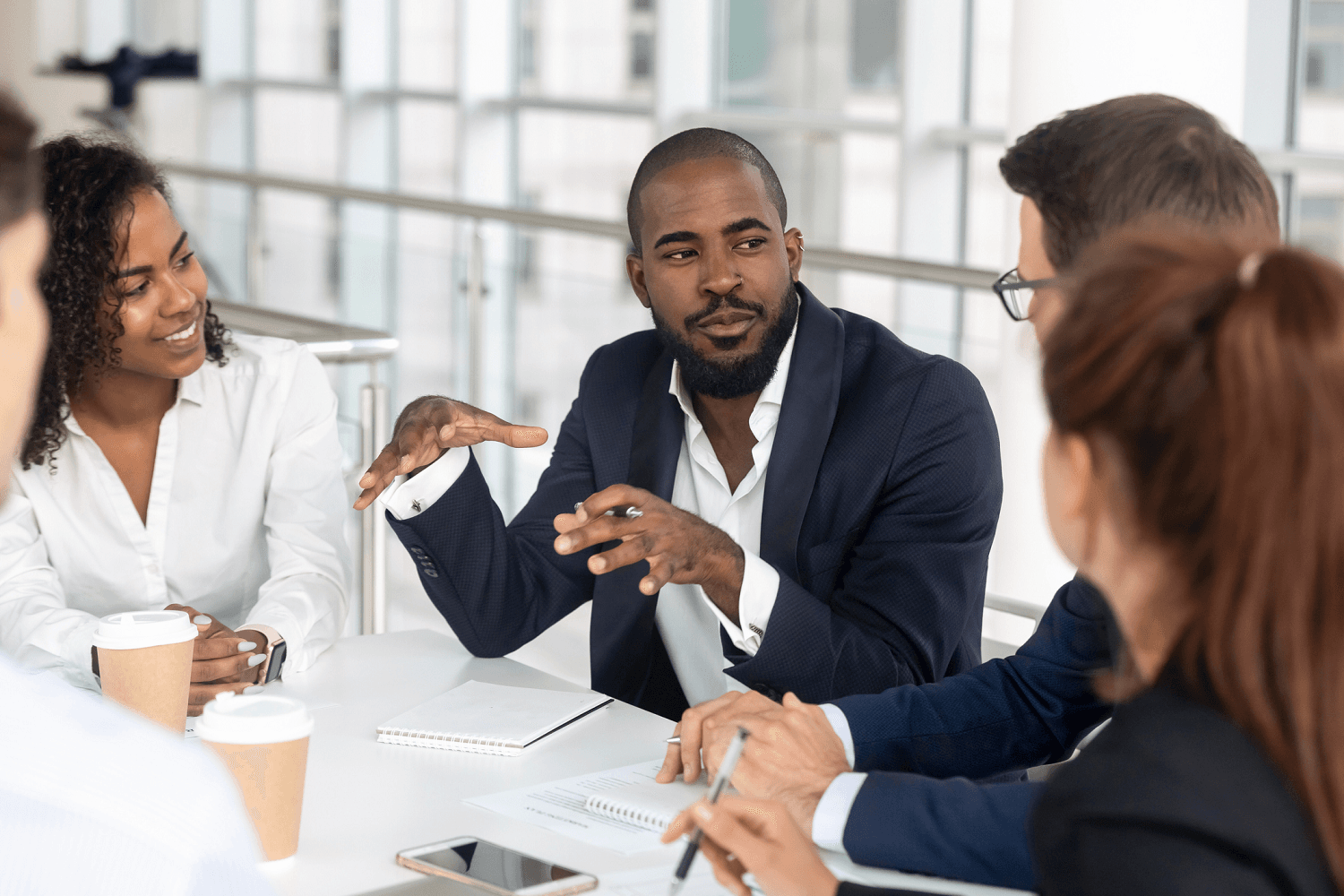Manager leading a team meeting