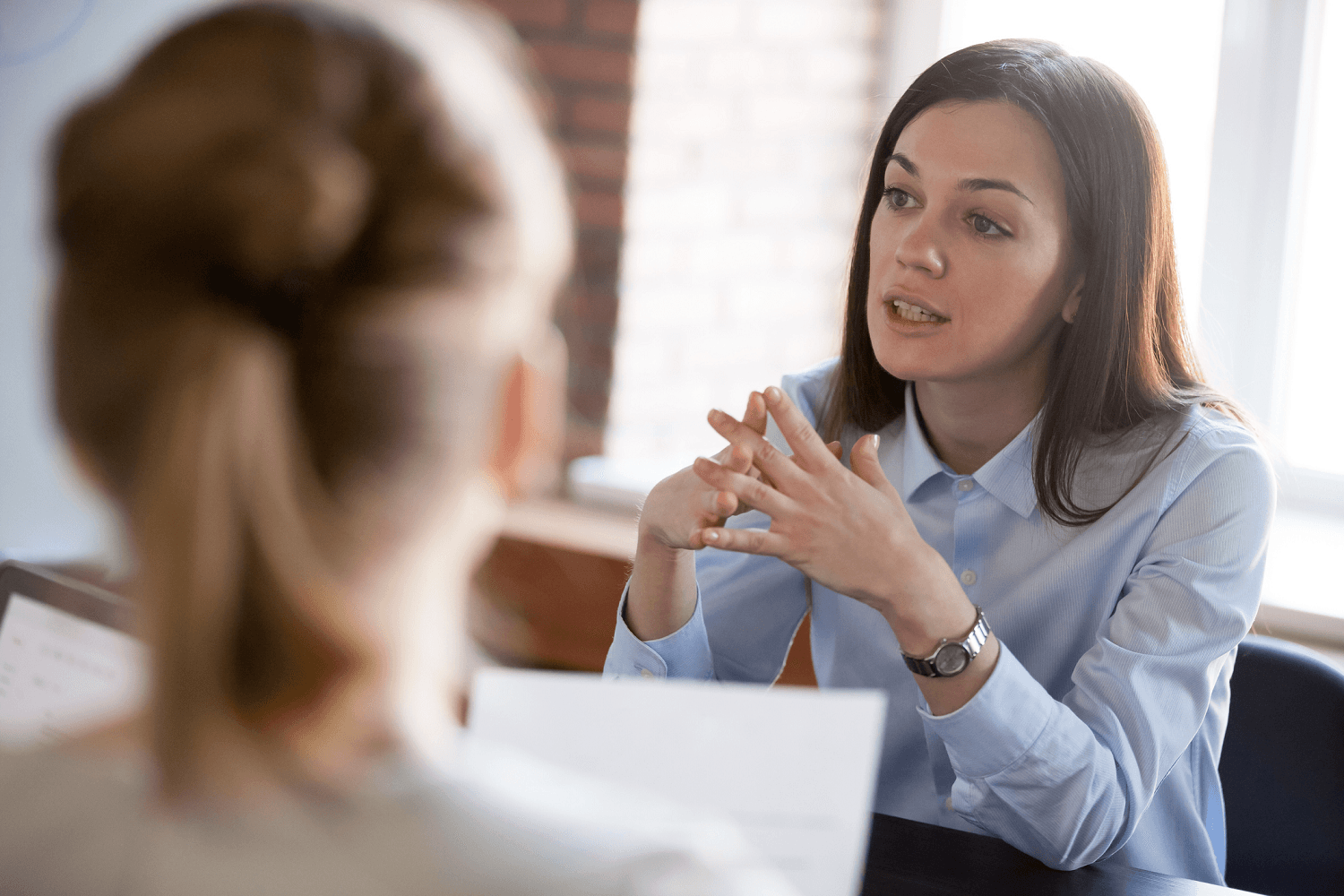 Two colleagues having an HR-related discussion