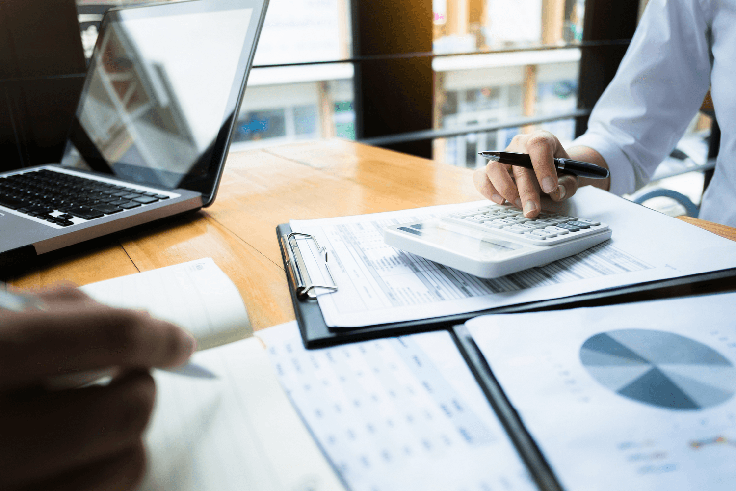 Businessperson calculating finances